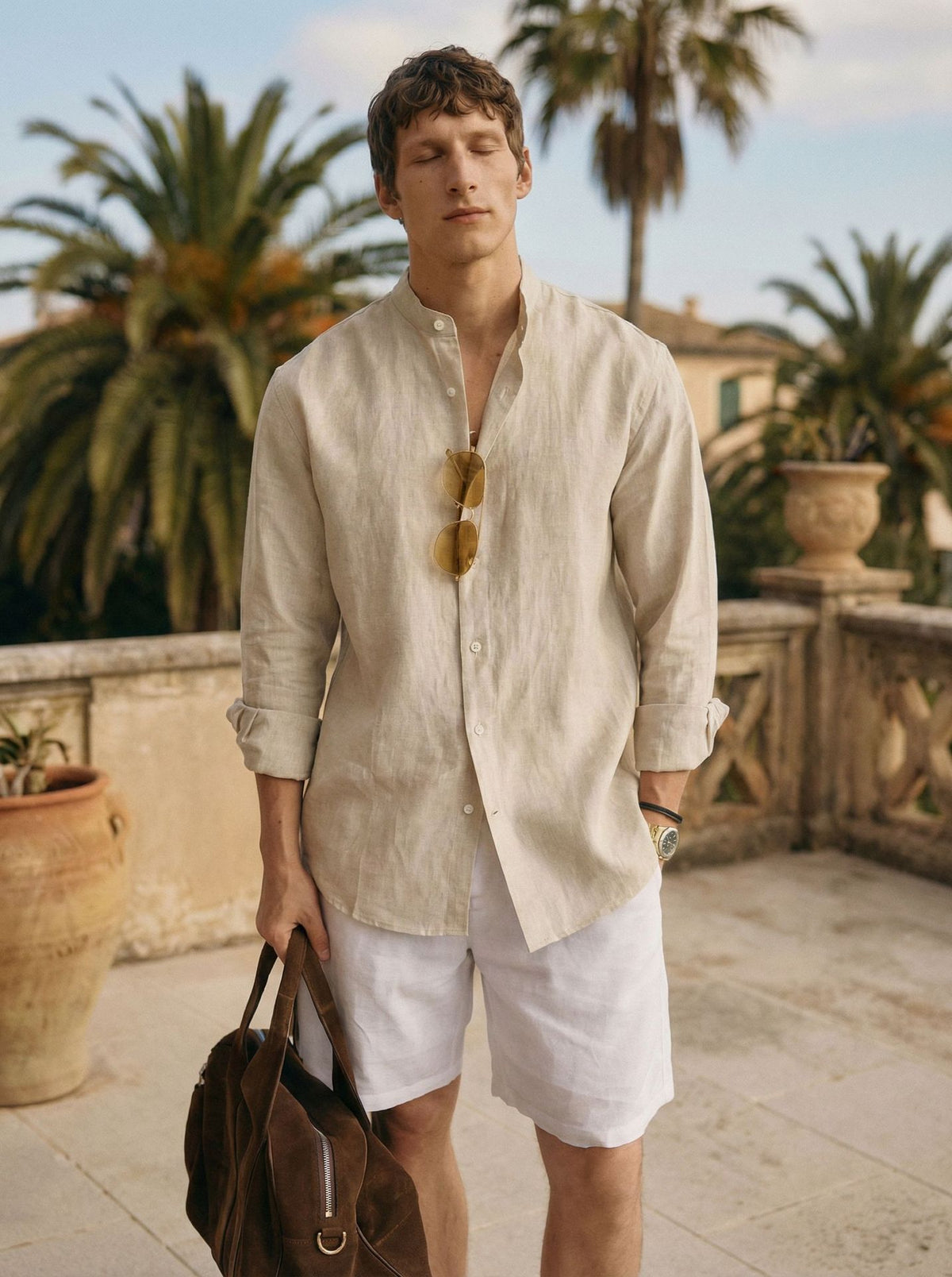 Men's beige linen button-up shirt, loose fit, long sleeves, side view