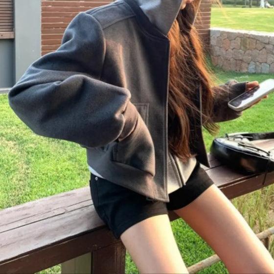 Dark gray short baseball jacket with snap button placket and ribbed V-neck collar
