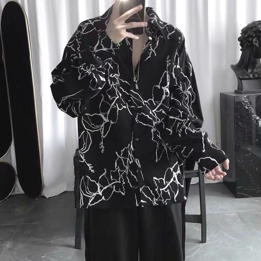 Black loose-fit short-sleeve shirt with white abstract floral pattern, full front view