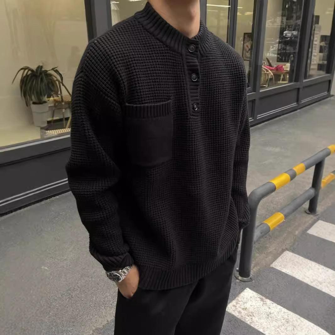 Men's black textured knit sweater with ribbed henley collar and front button placket