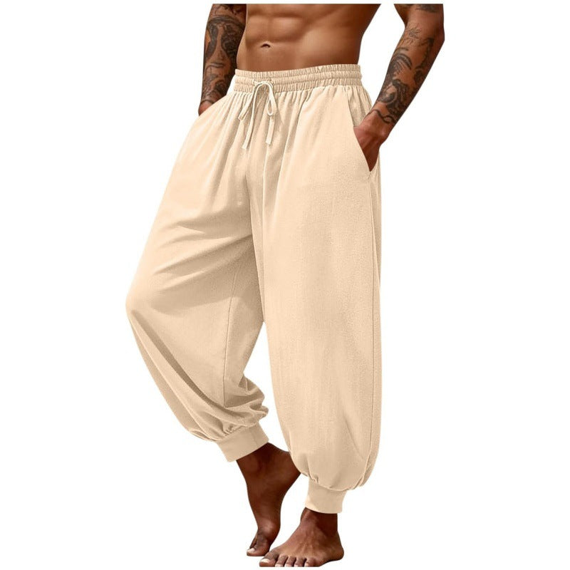 Men's breathable casual pants in light beige, elastic waistband with drawstring, cuffed hem.