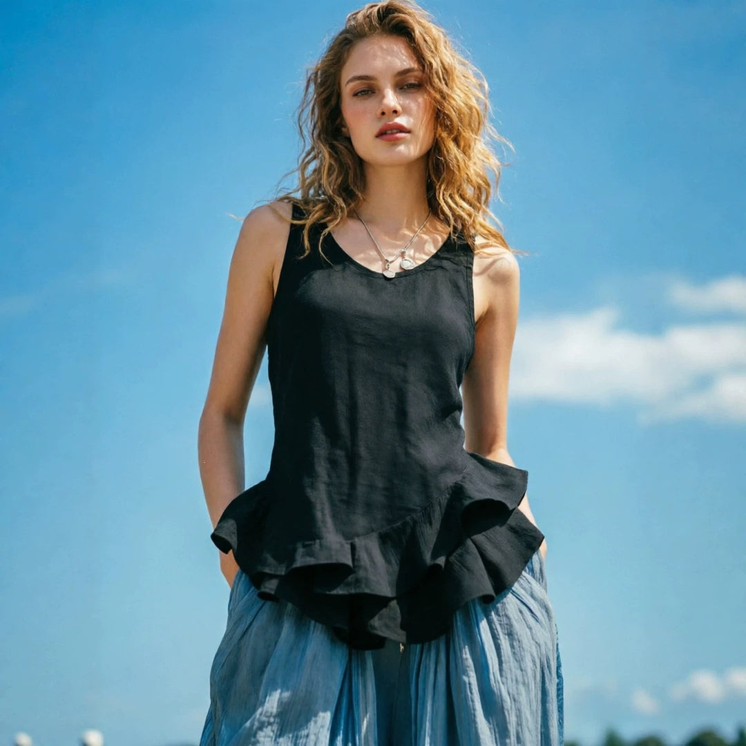Black sleeveless top with ruffled hem and V-neck