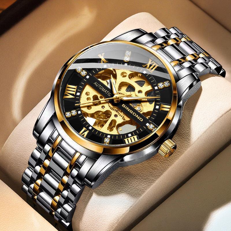 Automatic mechanical watch with silver two-tone bracelet and black/gold skeleton dial