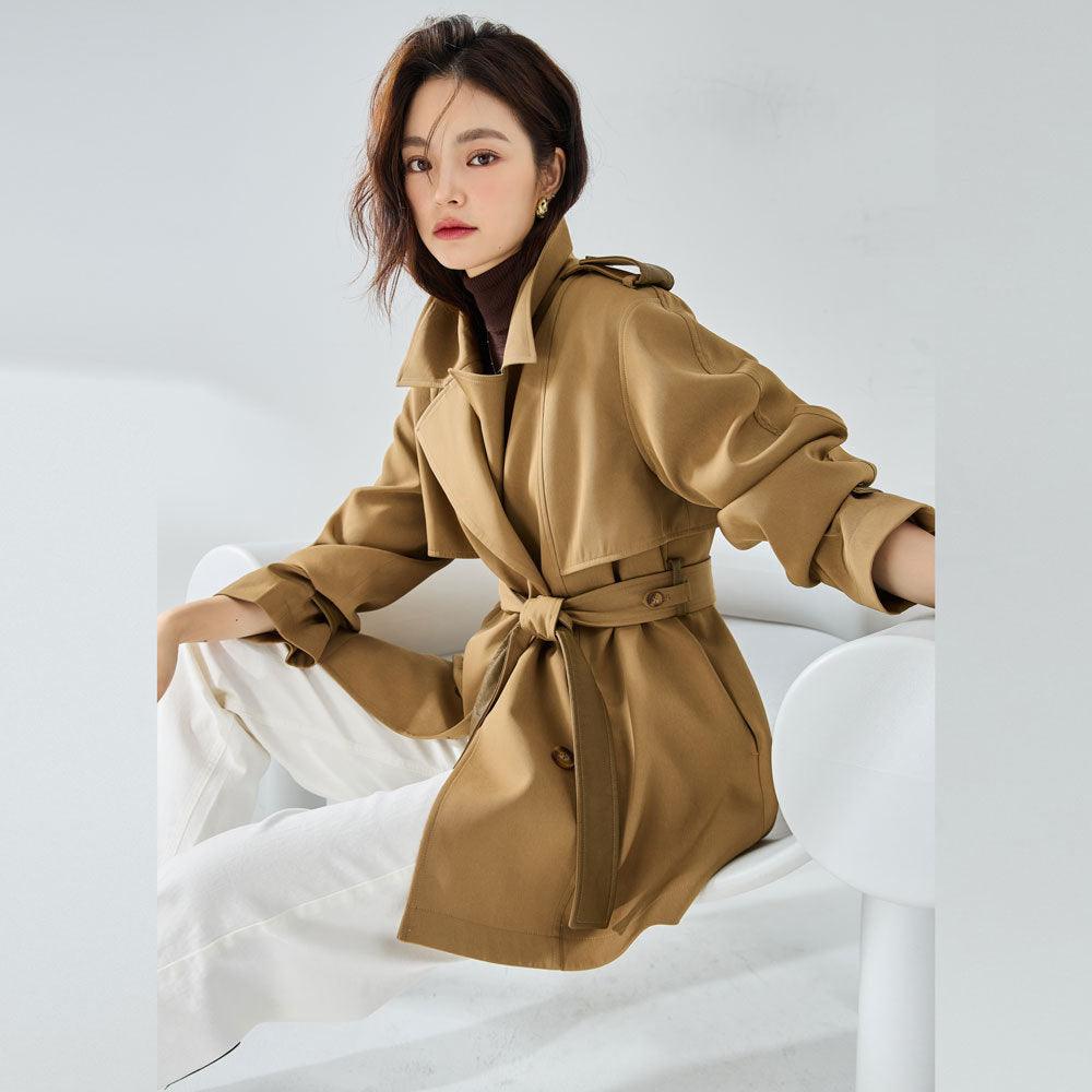 Short khaki trench coat with belted waist, notched collar, flap pockets