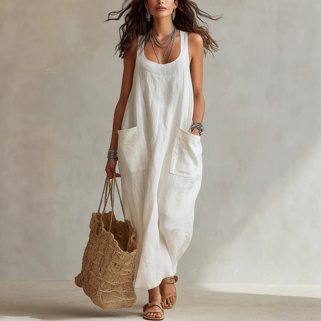 White long sleeveless slip dress with scoop neck and side patch pockets