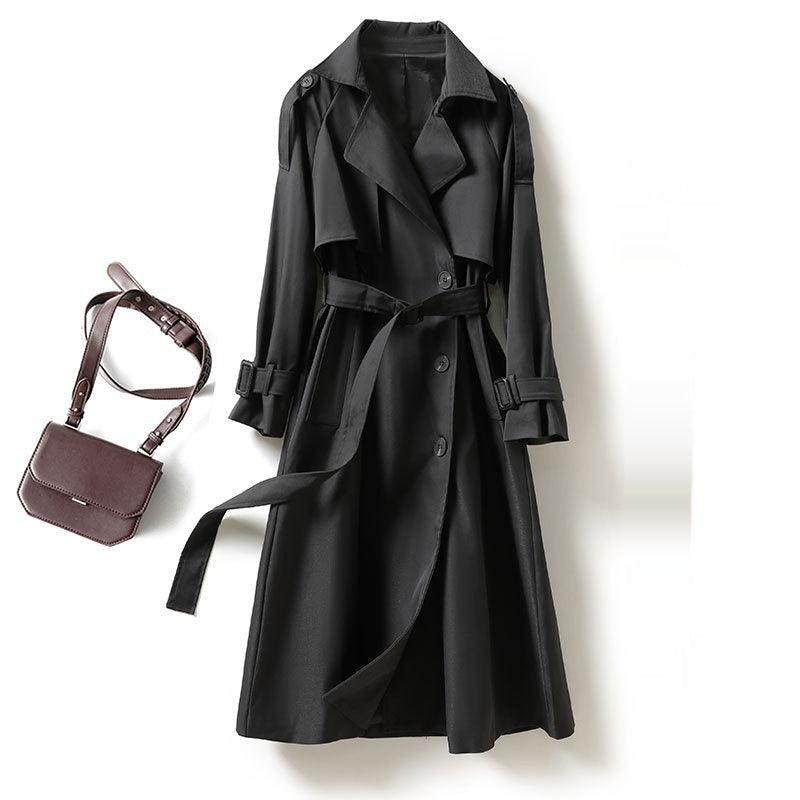 Women's mid-length black trench coat, flap sleeves and belted waist, buttoned front