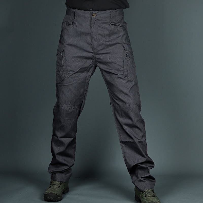 Dark gray tactical pants with cargo pockets and stitched knee reinforcement