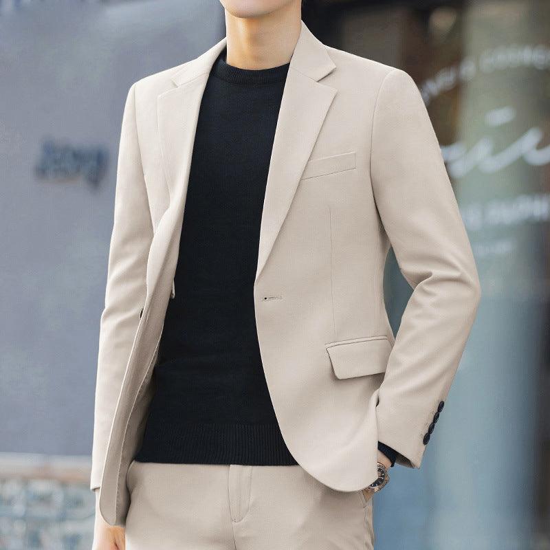 Men's slim-fit cream suit jacket with notch lapels, chest pocket, and flap pocket