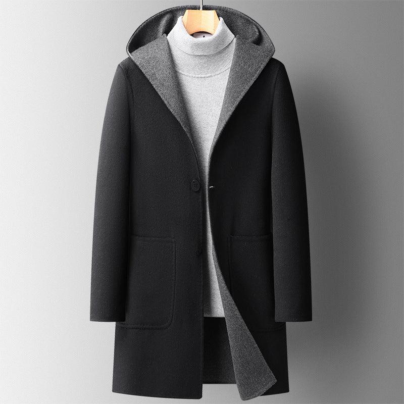 Men's hooded wool overcoat, black with gray hood lining, button front and side pockets.