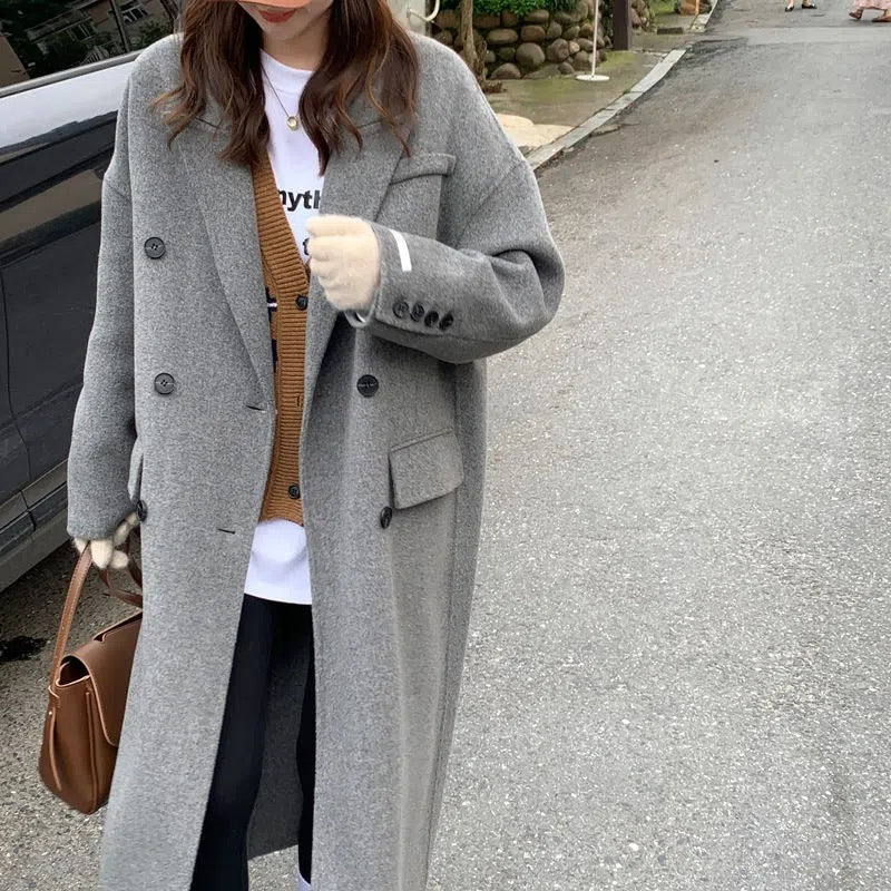 Women’s gray long coat with double-breasted button front and notched lapels