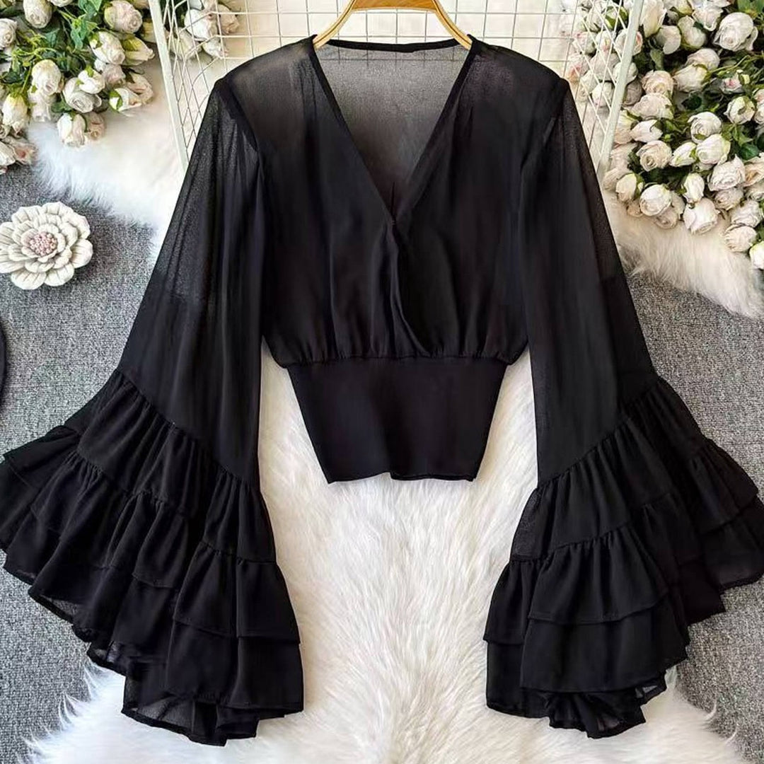 Black deep V-neck flared-sleeve top with tiered ruffle cuffs and fitted bodice