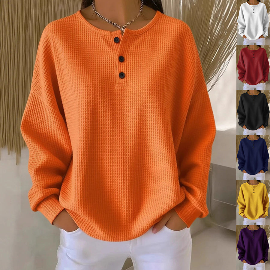 Orange waffle knit henley long-sleeve with round neck and 3-button placket