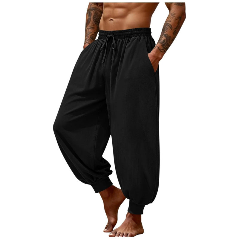 Men's breathable casual pants in black, elastic waistband with drawstring, cuffed ankle hem.