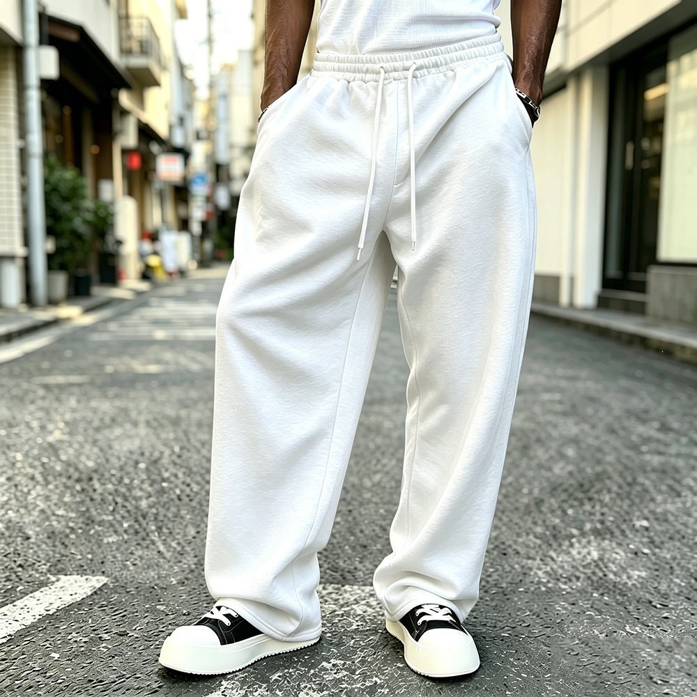 Loose fleece-lined sweatpants with elastic drawstring waistband, white, relaxed straight legs