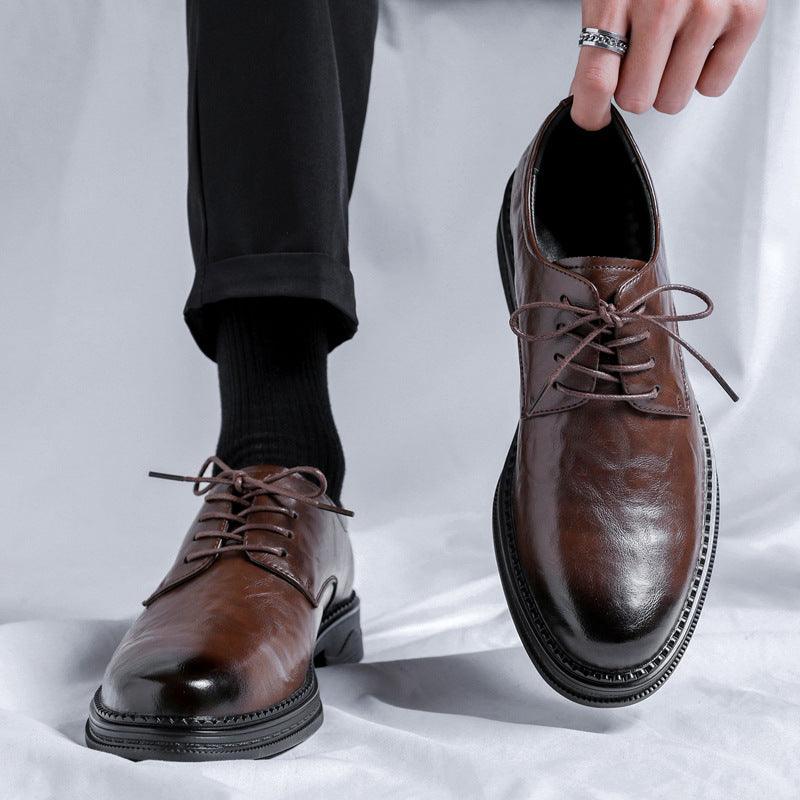 Brown leather oxford shoes with lace-up front and thick rubber sole