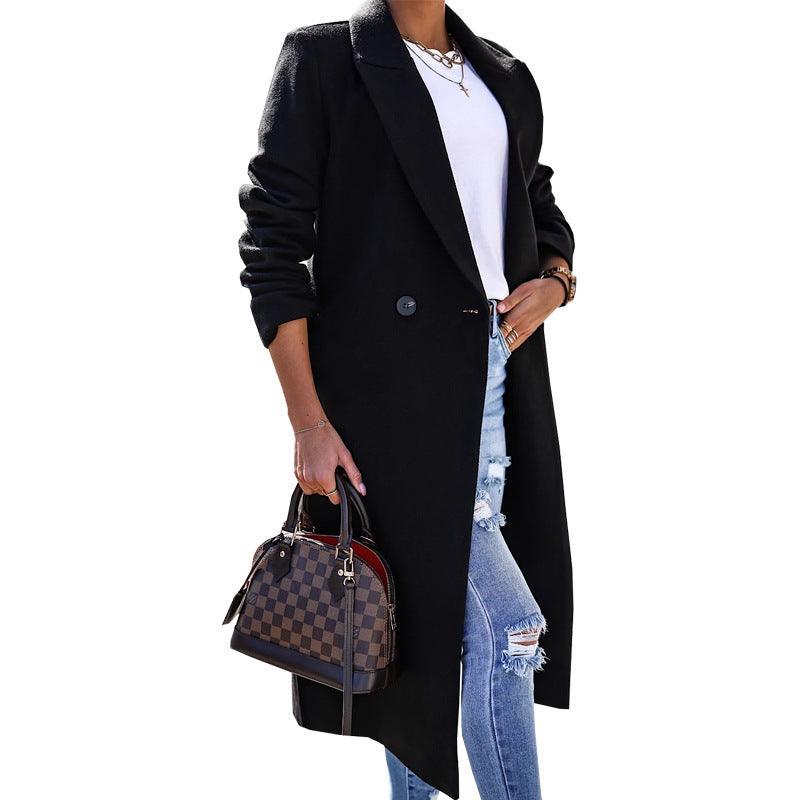 Black long sleeve lapel button coat with notched collar and side split hem.