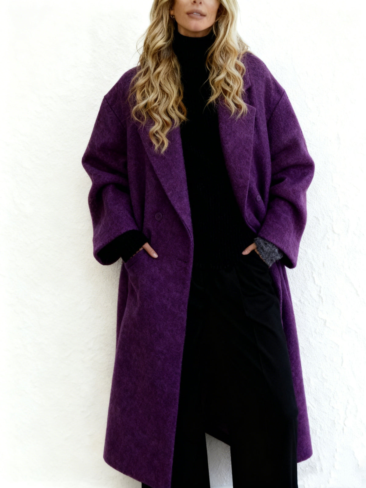 Women's long wool overcoat in deep purple with long sleeves and front pockets