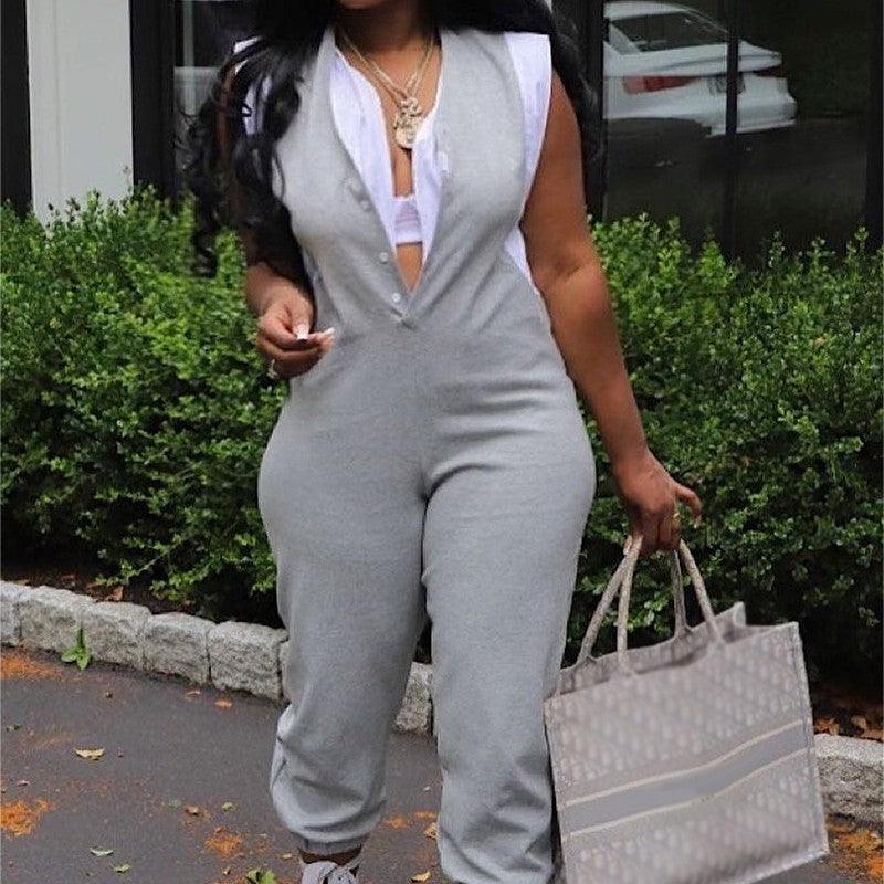 Gray sleeveless long jumpsuit with V-neck and white faux two-piece inset