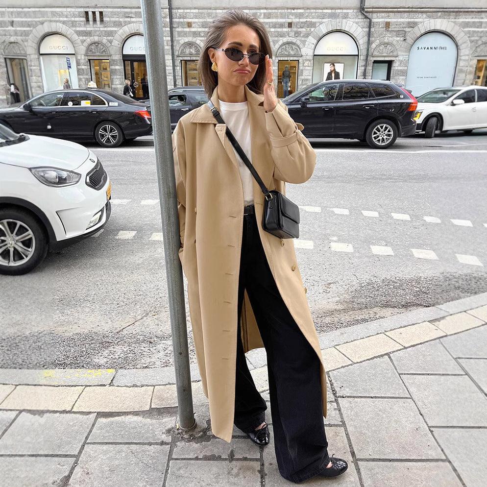 Khaki double-breasted trench coat with notched lapels and long buttoned front