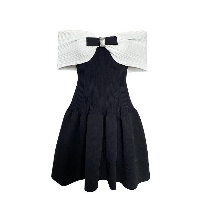 Off-shoulder knitted dress, black with white off-shoulder collar and bow, pleated flare