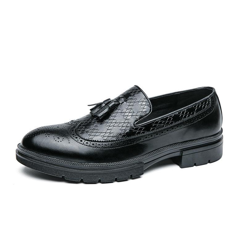 Youth black leather slip-on shoe with tassel fringe and brogue perforations