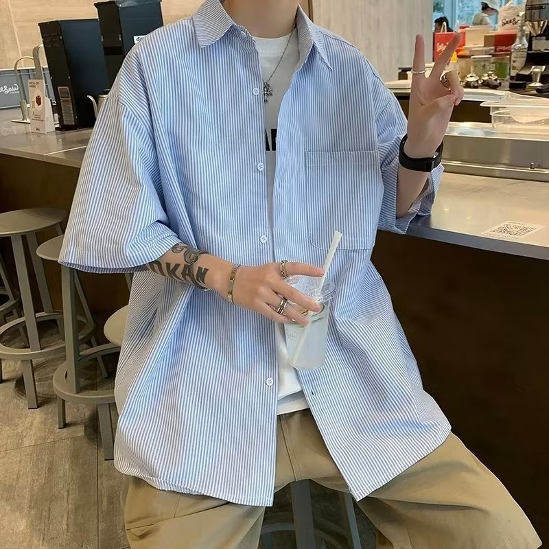 Light blue striped short-sleeve button-up shirt with chest pocket, relaxed fit