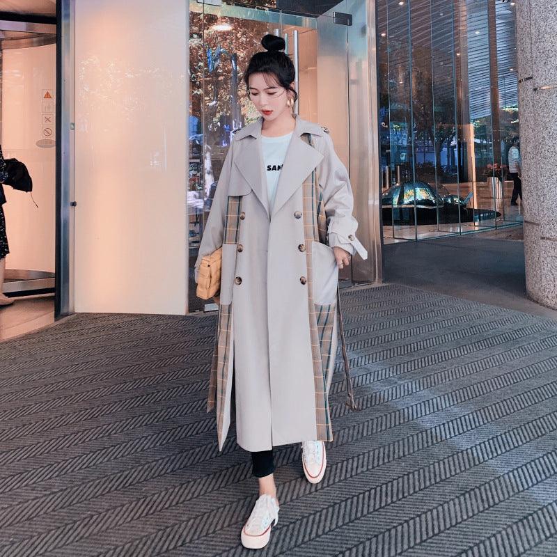 Cream long double-breasted jacket with flap pockets, button front, notch lapels, waist tie