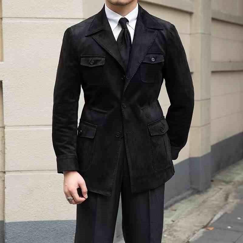 Black trench coat with notch lapels, flap pockets, and button front
