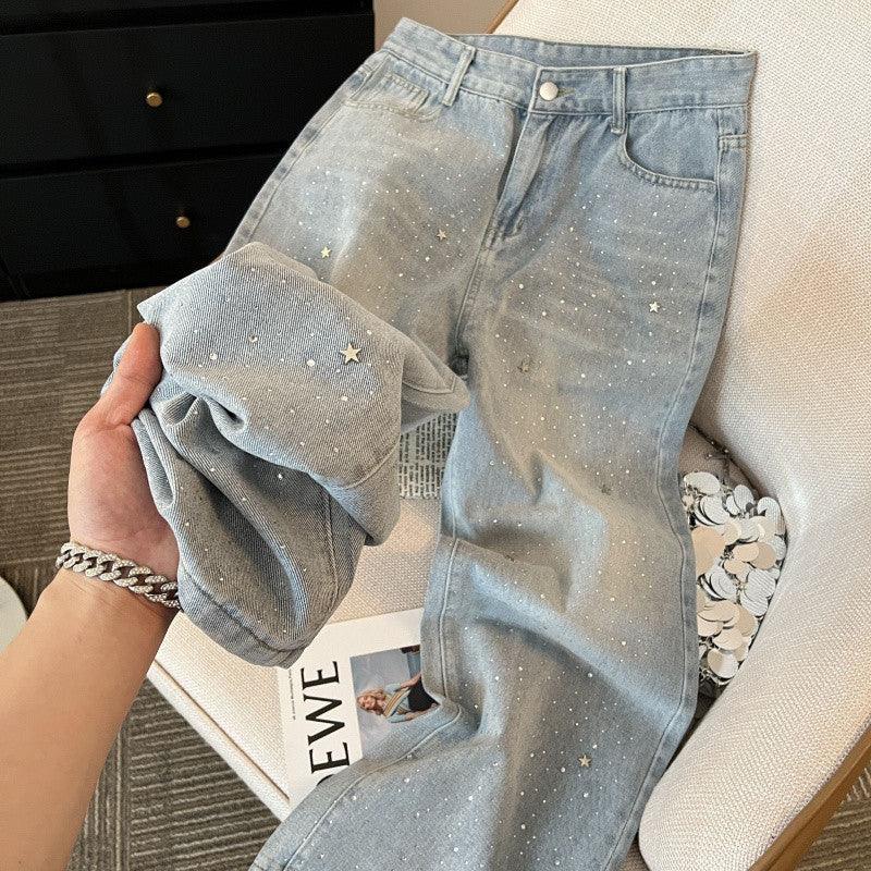 Light blue high-waist wide-leg denim trousers with star speckle print and button fly