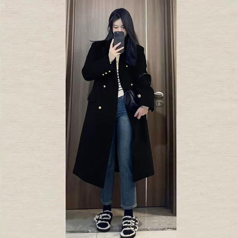 Black woolen coat with gold buttons and wide lapels, long straight silhouette