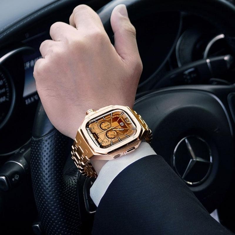 Rose gold smartwatch with metal link bracelet on a wrist, square bezel and multicolor dial
