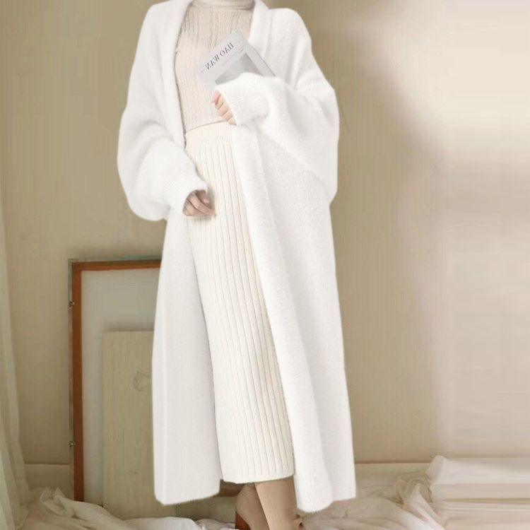 White long cardigan sweater with open front and long sleeves.