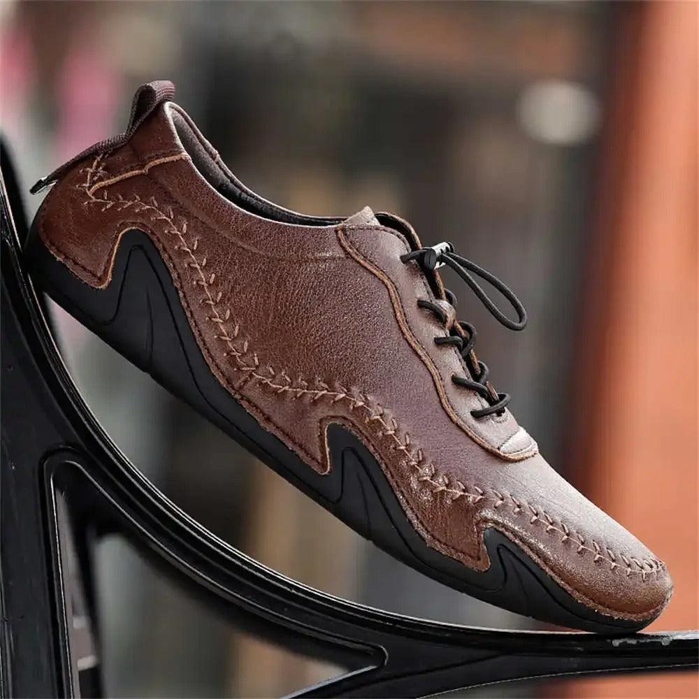 Dark brown leather lace-up shoes with stitched panels and thick rubber sole