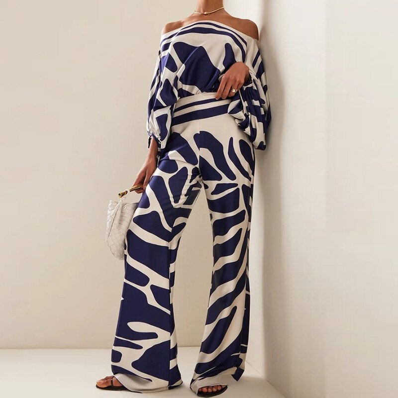 Navy and cream abstract print wide-leg pants with high waist and relaxed fit.