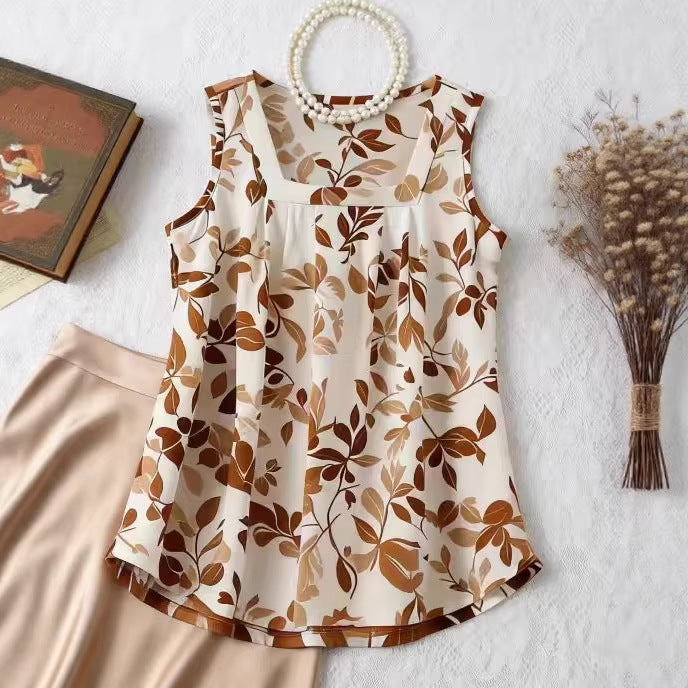 Sleeveless loose camisole top with apricot and brown leaf print on cream base