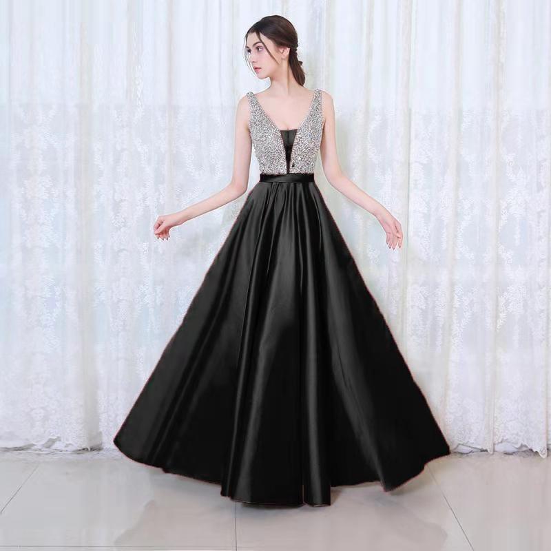 Black off-shoulder dress with sequin bodice and full satin skirt
