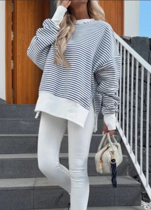 Blue and white striped round-neck sweater with long sleeves and relaxed fit