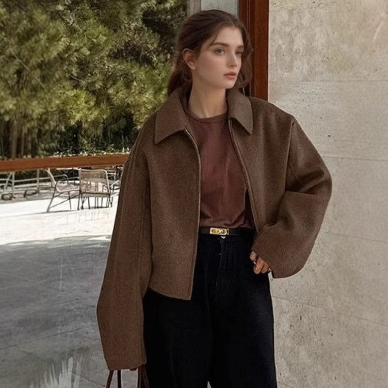 Women's loose casual brown jacket, zip-front with flap collar and side pockets.