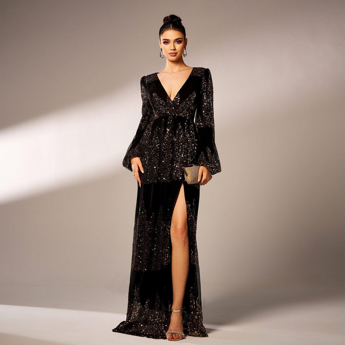 Black sequined V-neck evening dress with long flared sleeves and front side slit