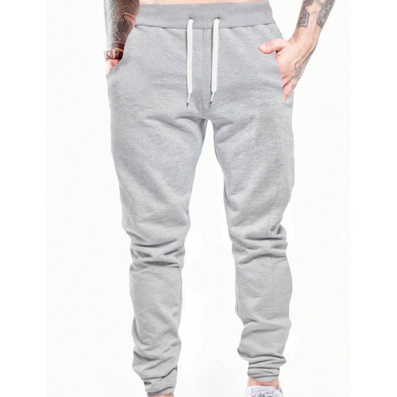Men's gray drawstring jogger pants with front drawcord and tapered cuffs