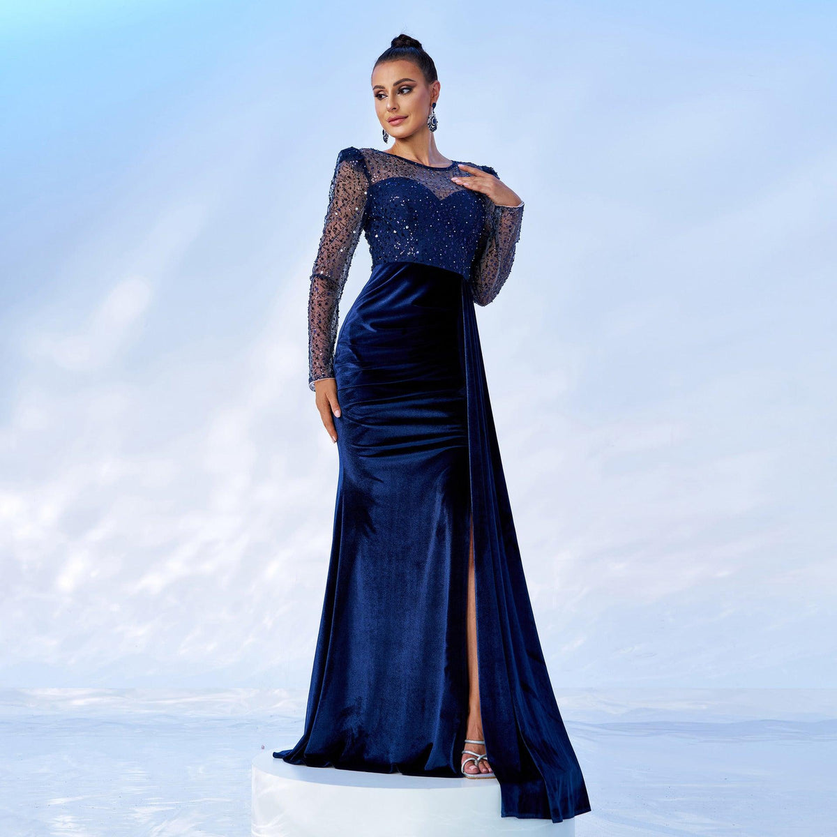 Blue velvet fishtail evening dress with sequined mesh sleeves and fitted bodice