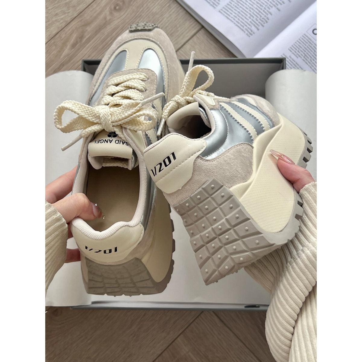 Light silver and white lace-up platform sneakers with textured tread and padded tongue