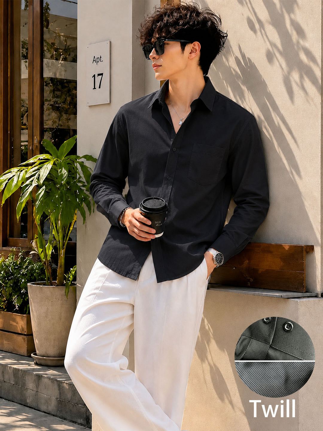 Men's black long-sleeve button-up shirt with chest pocket, solid woven fabric
