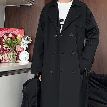 Black long overcoat with wide lapels, double-breasted buttons, and flap side pockets.