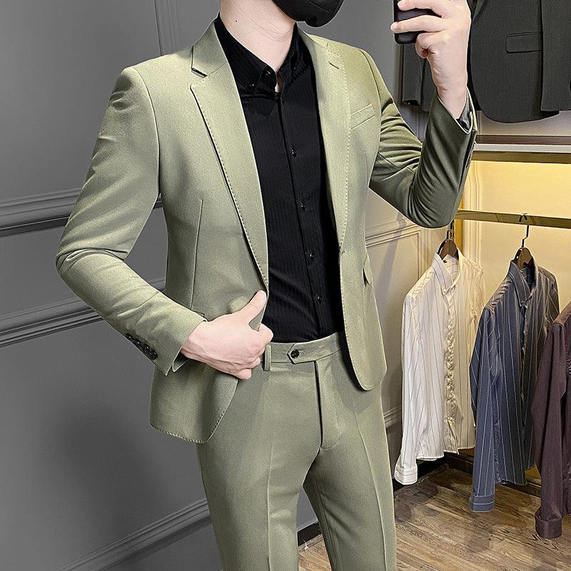 Men's slim-fit business suit, olive-green blazer and matching trousers with tailored seams.