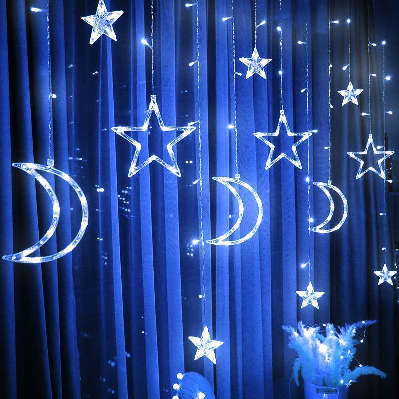 Blue cool-white moon and star curtain string lights with dangling star shapes and arcs