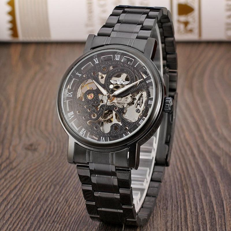 Black mechanical skeleton watch with steel link strap and Roman numeral dial