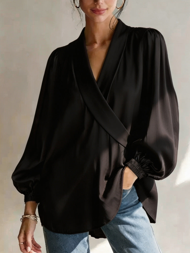 Women's black V-neck long-sleeve top with draped front and puff sleeves