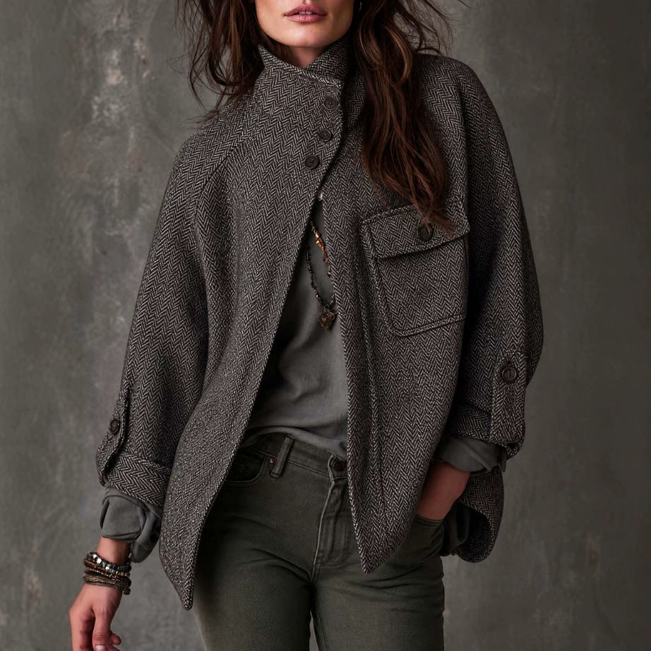 Women’s oversized gray herringbone wool coat with button front and chest flap pockets
