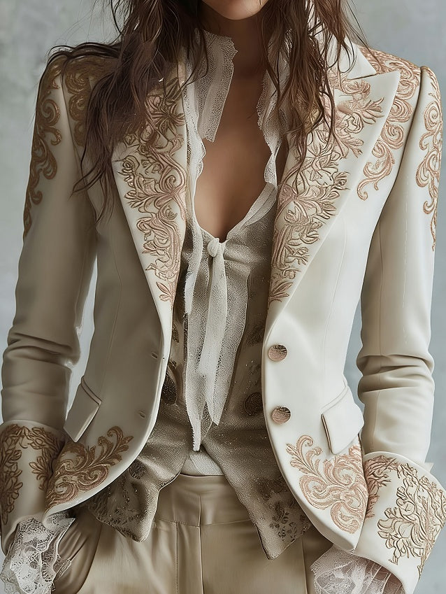White velvet blazer with gold embroidered lapels, flared sleeves, button front and pockets